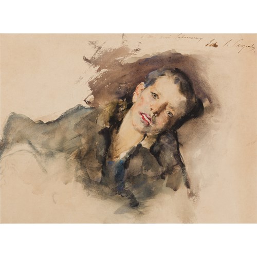 A Young Boy Lying on a Cushion